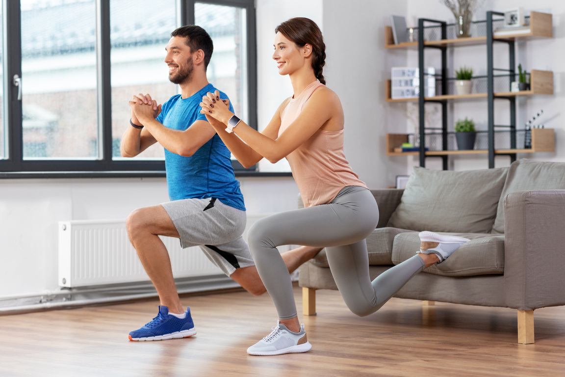 Couple Exercising and Doing Lunge at Home